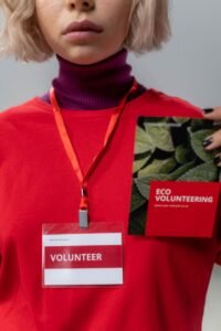 close up photo of personholding red brochure